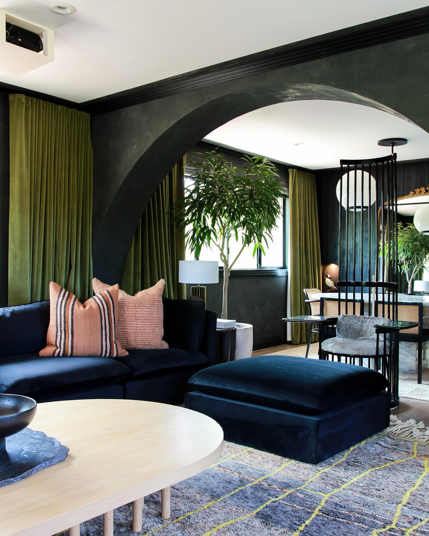Moody living room with velvet sofa.